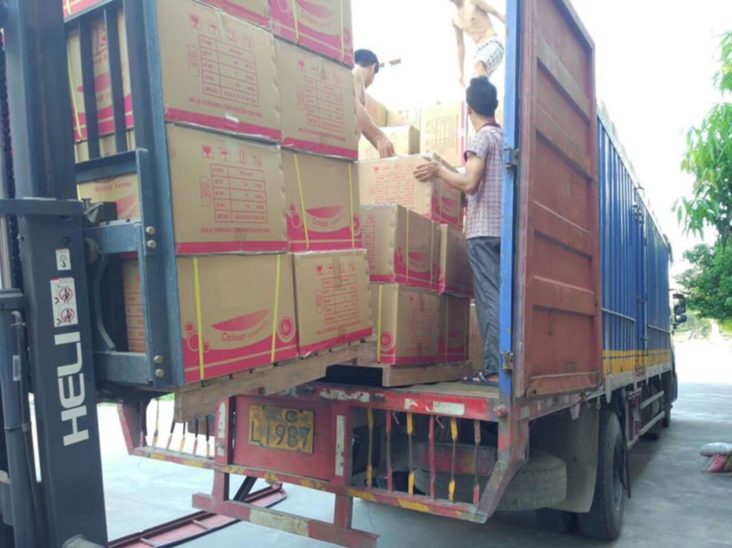 Workers packing boxes in the warehouse