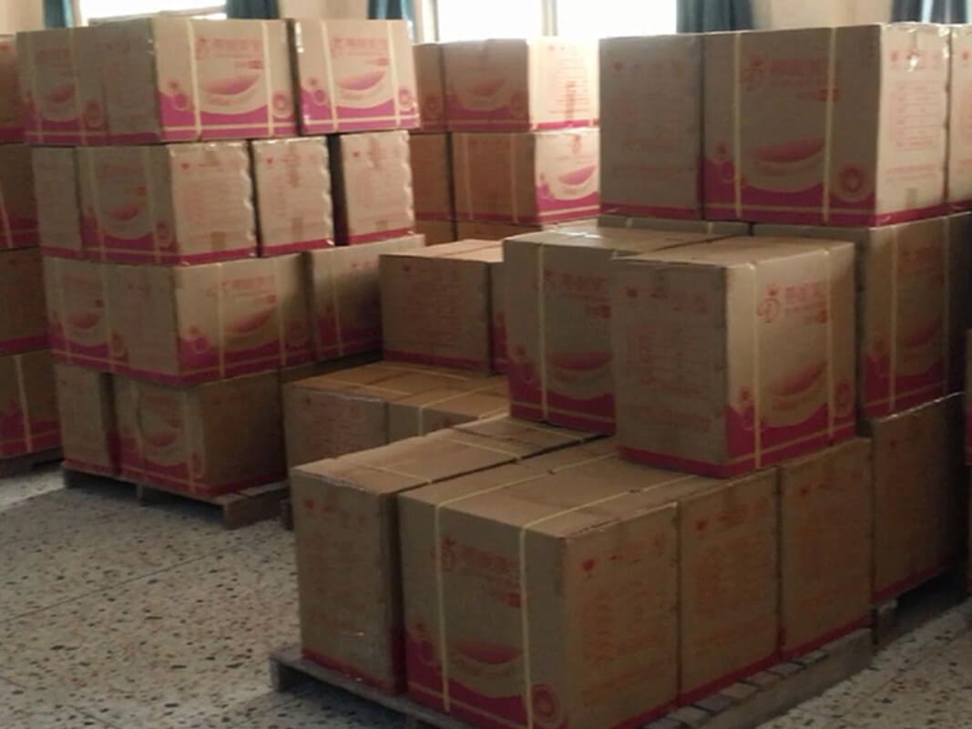 Organized warehouse section filled with finished goods ready for shipment
